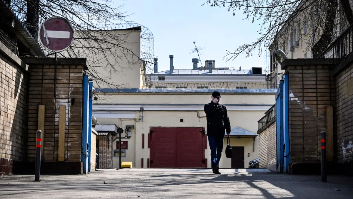 A man walks in front of the entrance to the Lefortovo prison, where Robert Robertovich Shonov is reportedly being held on espionage charges, on April 12, 2023. (Alexander Nemenov/AFP via Getty Images)