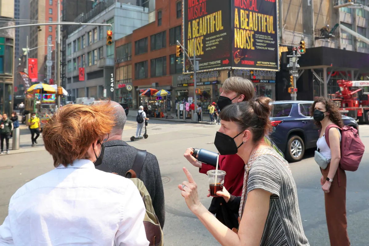 People wear masks in Times Square, NYC, on June 8, 2023. (Michael M. Santiago/Getty Images)