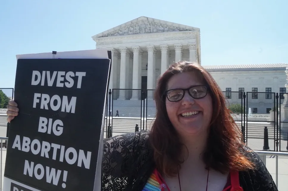 Left-wing pro-life protester Lauren Handy, the director of activism with Progressive Anti-Abortion Uprising, protests outside the U.S. Supreme Court on June 15, 2022. (Jackson Elliott/The Epoch Times)