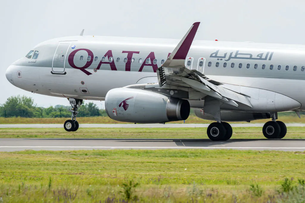 This photograph taken on June 7, 2023, shows an Qatar Airways Airbus A320 aircraft landing at Belgrade Nikola Tesla Airport. (Andrej Isakovic/AFP via Getty Images)