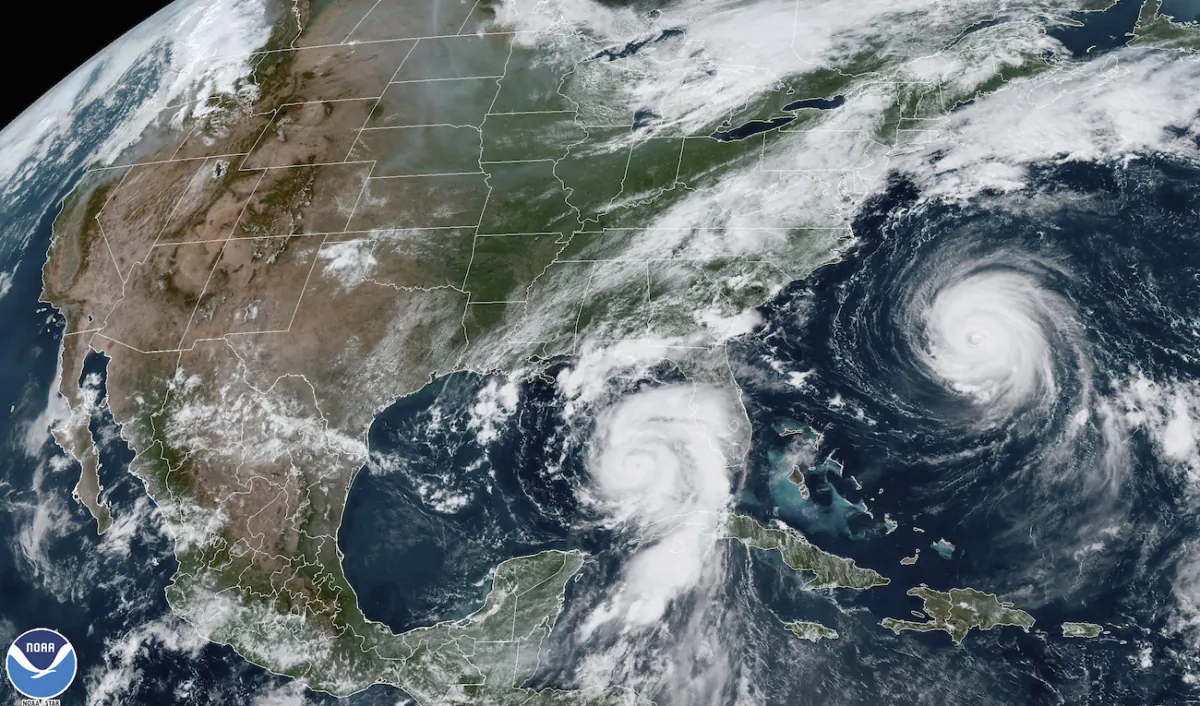 A satellite image shows Hurricane Idalia, center, approaching Florida's Gulf Coast, and Hurricane Franklin, right, as it moves along the East coast of the United States, southwest of Bermuda, at 1:31 p.m. EDT on Aug. 29, 2023. (NOAA via AP)