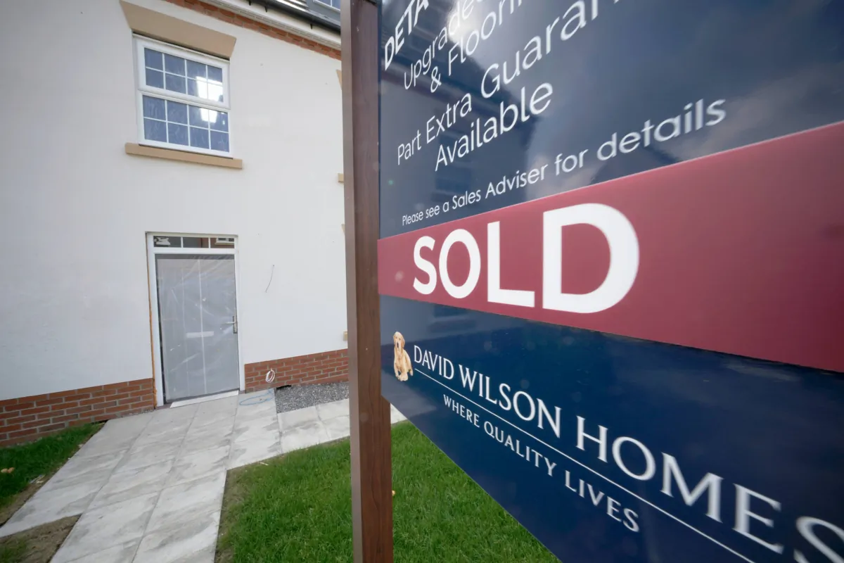 A sold sign is seen outside new houses on a construction development in Nantwich, England, on June 22, 2023. (Christopher Furlong/Getty Images)