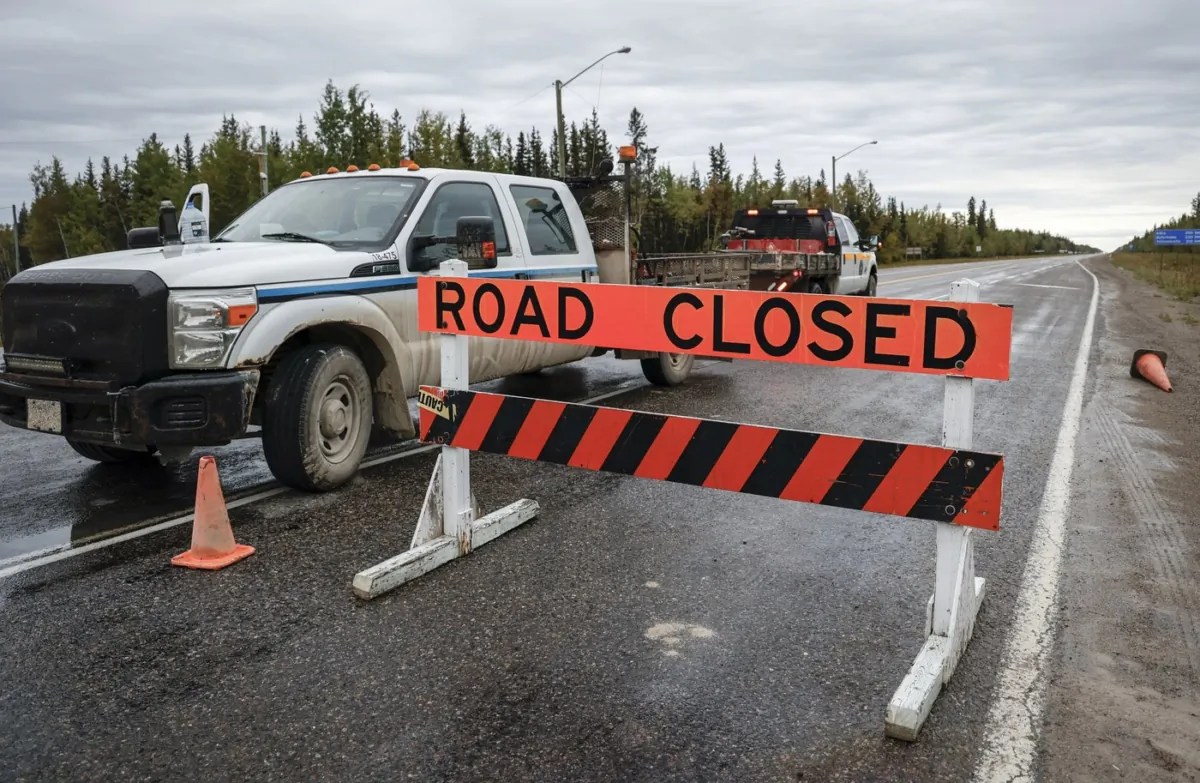 The road is closed north to Yellowknife from Fort Providence, N.W.T., on Aug. 17, 2023. (The Canadian Press/Jeff McIntosh)