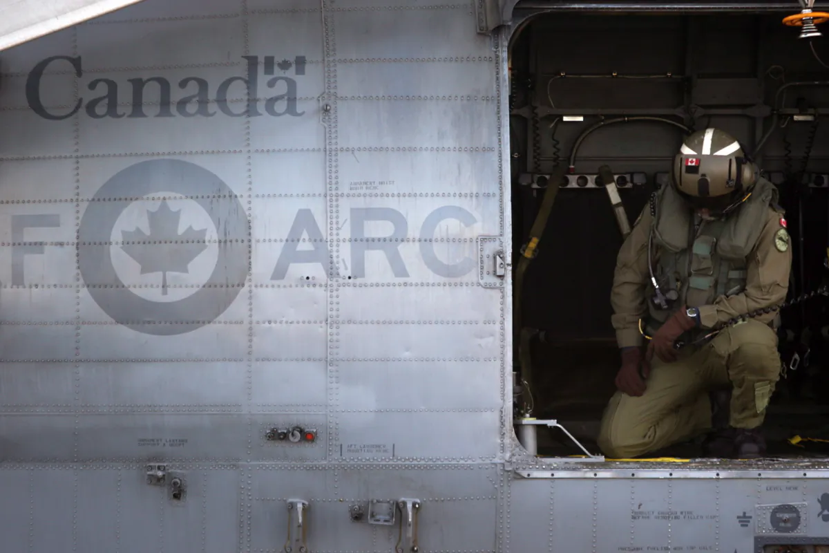 A RCAF crew member prepares for takeoff aboard the CH-124 Sea King helicopter at 443 Maritime Helicopter Squadron in Saanich, B.C., on Nov. 27, 2018. (The Canadian Press/Chad Hipolito)