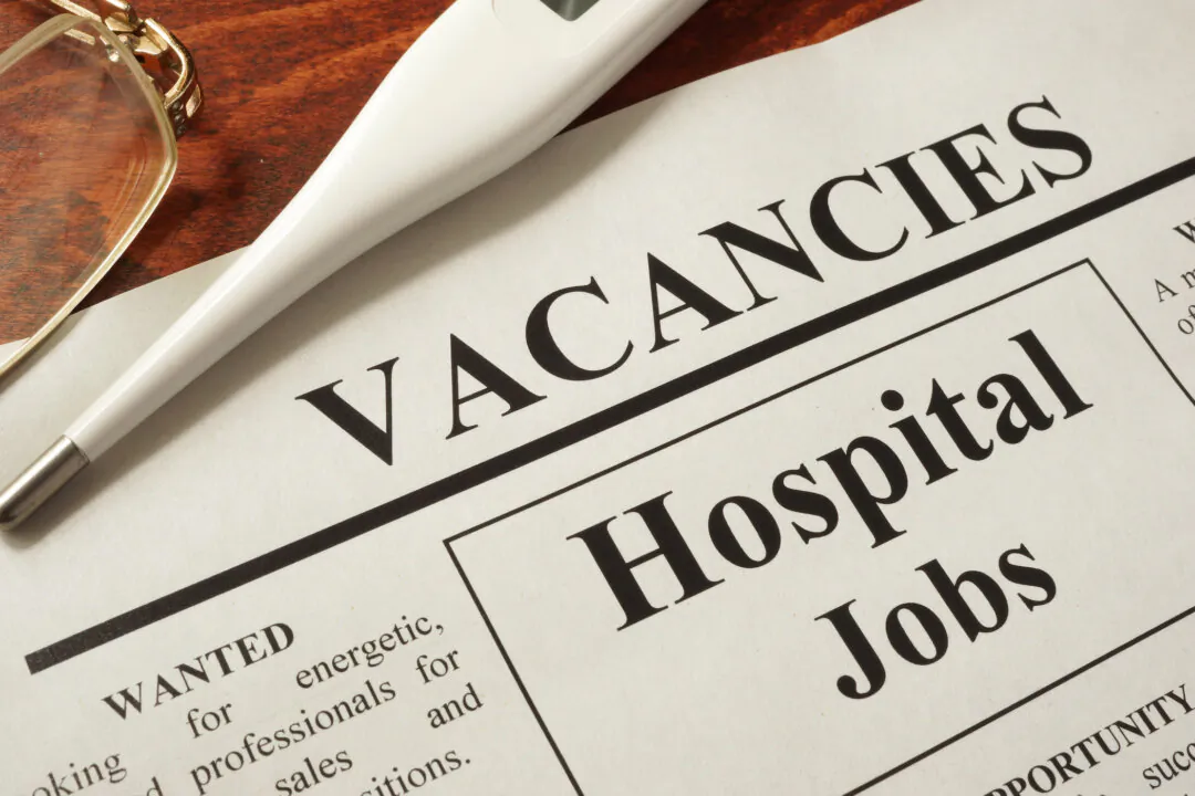 Newspaper with ads hospital jobs vacancy.