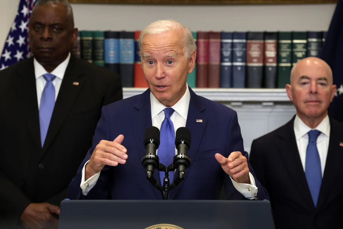 President Joe Biden speaks on the government response and recovery efforts on the wildfires on Maui, Hawaii and the ongoing response from the federal government to Hurricane Idalia as Secretary of Defense Lloyd Austin (L) and Secretary of Homeland Security Alejandro Mayorkas listen at the Roosevelt Room of the White House in Washington on Aug. 30, 2023. (Alex Wong/Getty Images)