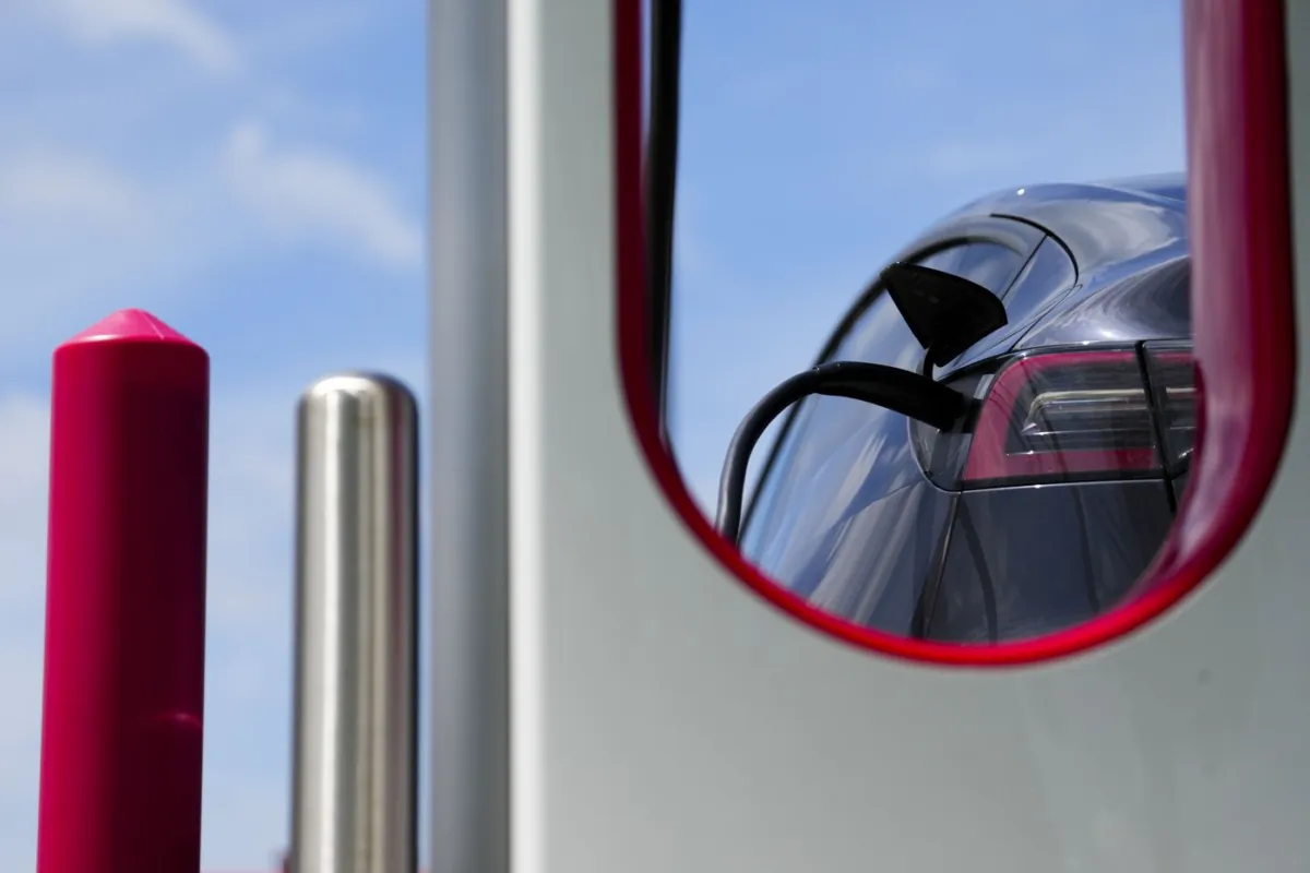 An electric vehicle is charged in Ottawa on July 13, 2022. (The Canadian Press/Sean Kilpatrick)