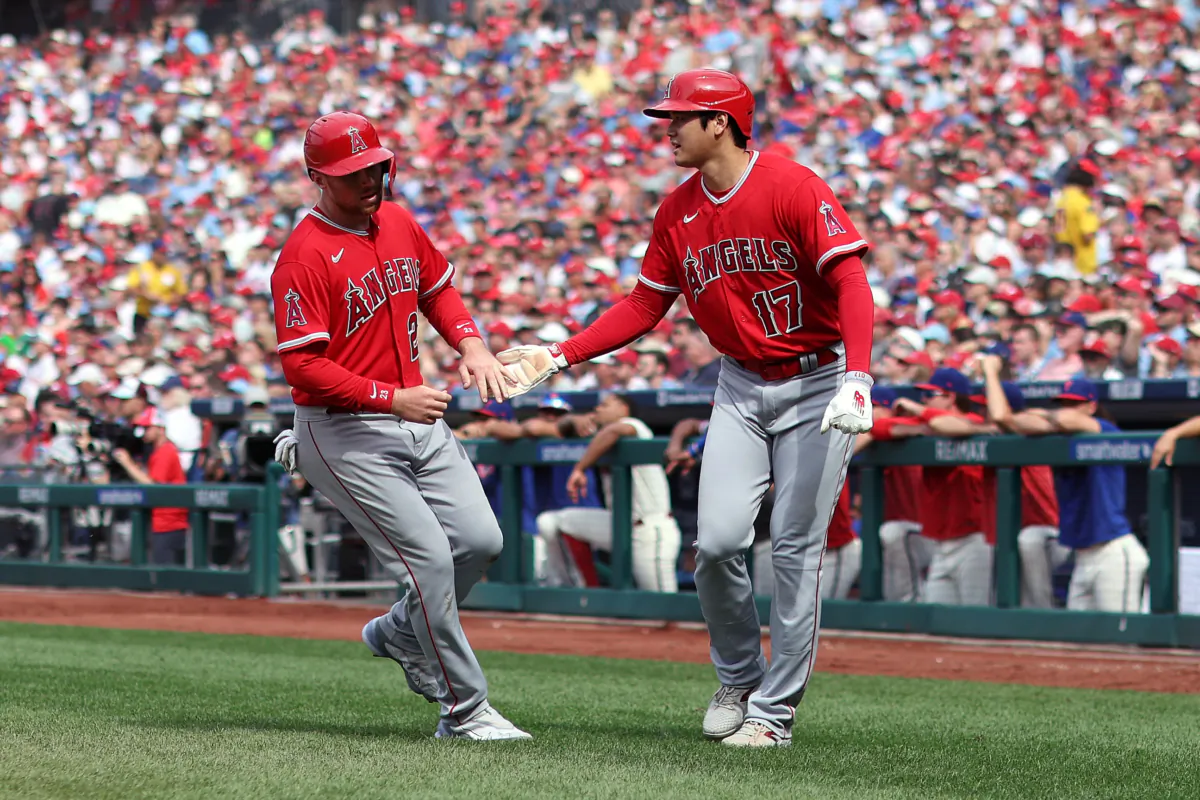 Brandon Drury (23) and Shohei Ohtani (17) of the Los Angeles Angels react after scoring during the eighth inning against the Philadelphia Phillies at Citizens Bank Park in Philadelphia on August 30, 2023. (Tim Nwachukwu/Getty Images)