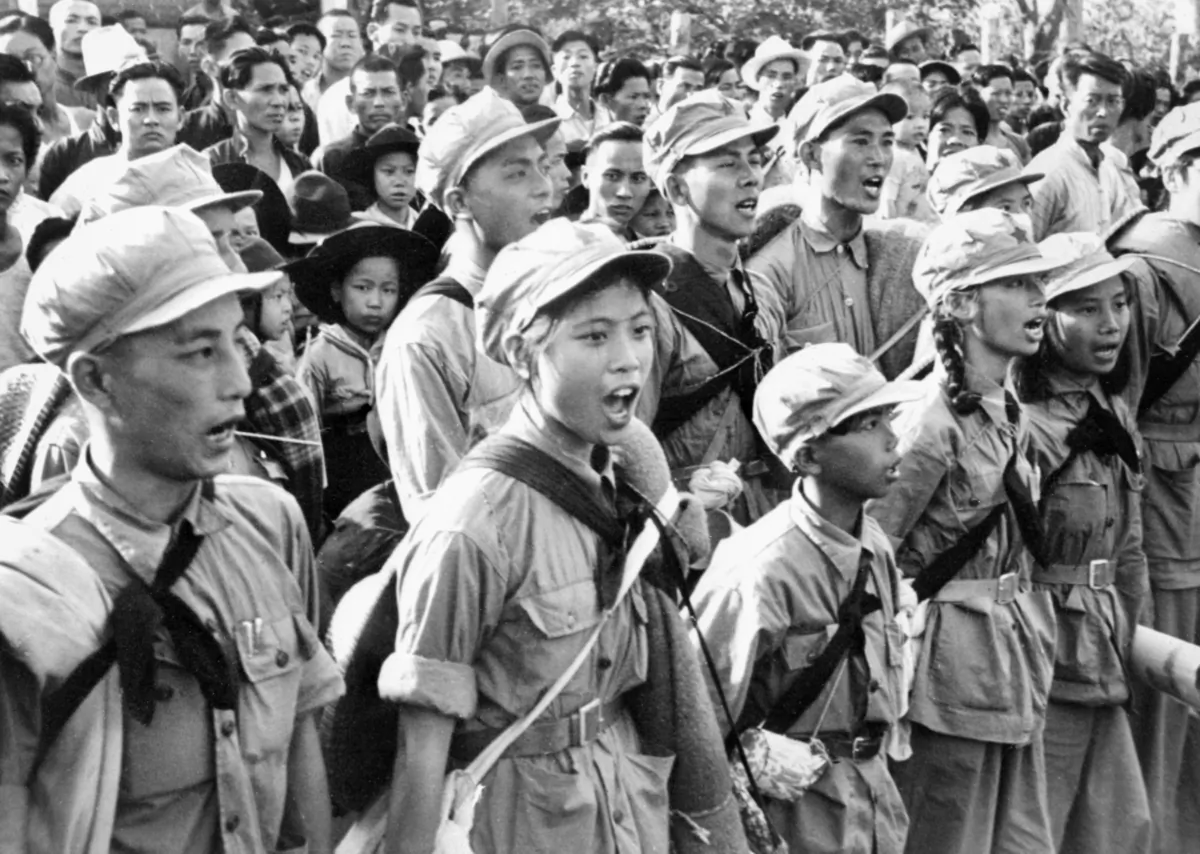 Communist Chinese soldiers sing a hymn to Mao Tse Tung as they arrive in Sham Chum, three kilometers north of the Hong Kong border on Oct. 25, 1949. (STAFF/AFP  Getty Images)