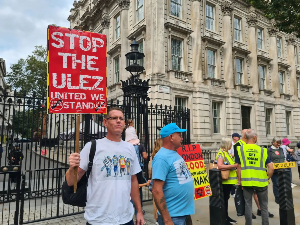 Protesters display signage criticising the mayor of London, Sadiq Khan, and the ULEZ expansion in Whitehall, London, on Aug 29 2023. (Joseph Robertson/The Epoch Times)