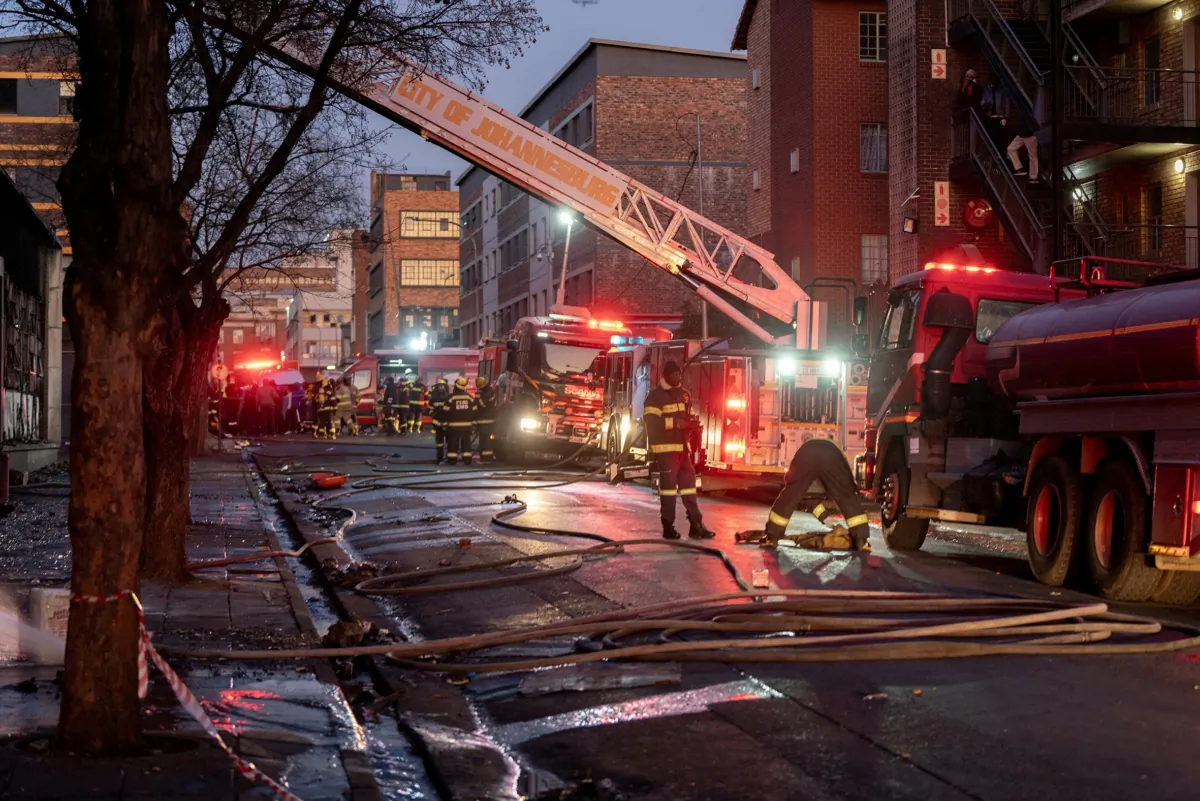 Firefighters work at the scene of a deadly blaze in the early hours of the morning, in Johannesburg, South Africa, on Aug. 31, 2023. (Shiraaz/Reuters)
