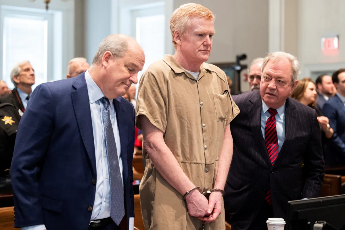 Alex Murdaugh speaks with his legal team before he is sentenced to two consecutive life sentences for the murder of his wife and son at the Colleton County Courthouse in Walterboro, S.C., on March 3, 2023. (Joshua Boucher/The State via AP)