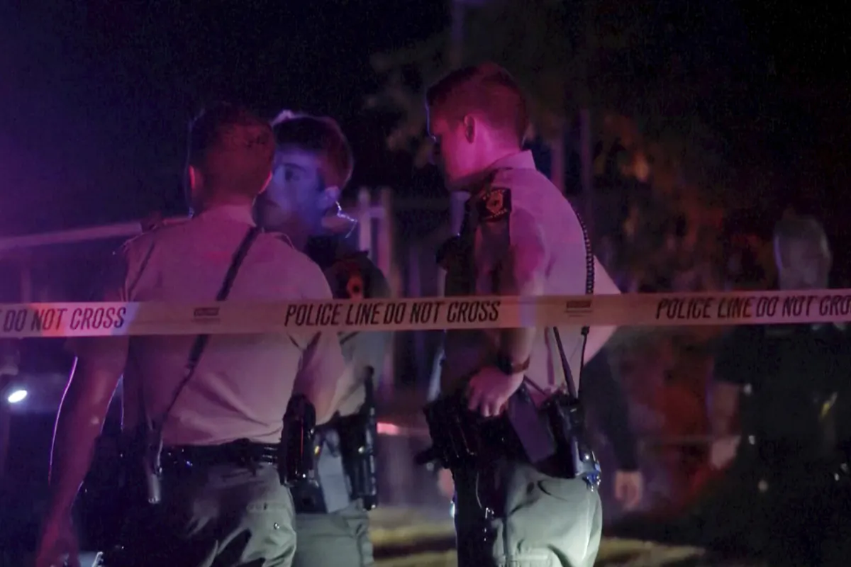 Law enforcement agents respond to the scene of a shooting in Peoria, Ill., on Aug. 30, 2023. (WEEK/WHOI via AP)