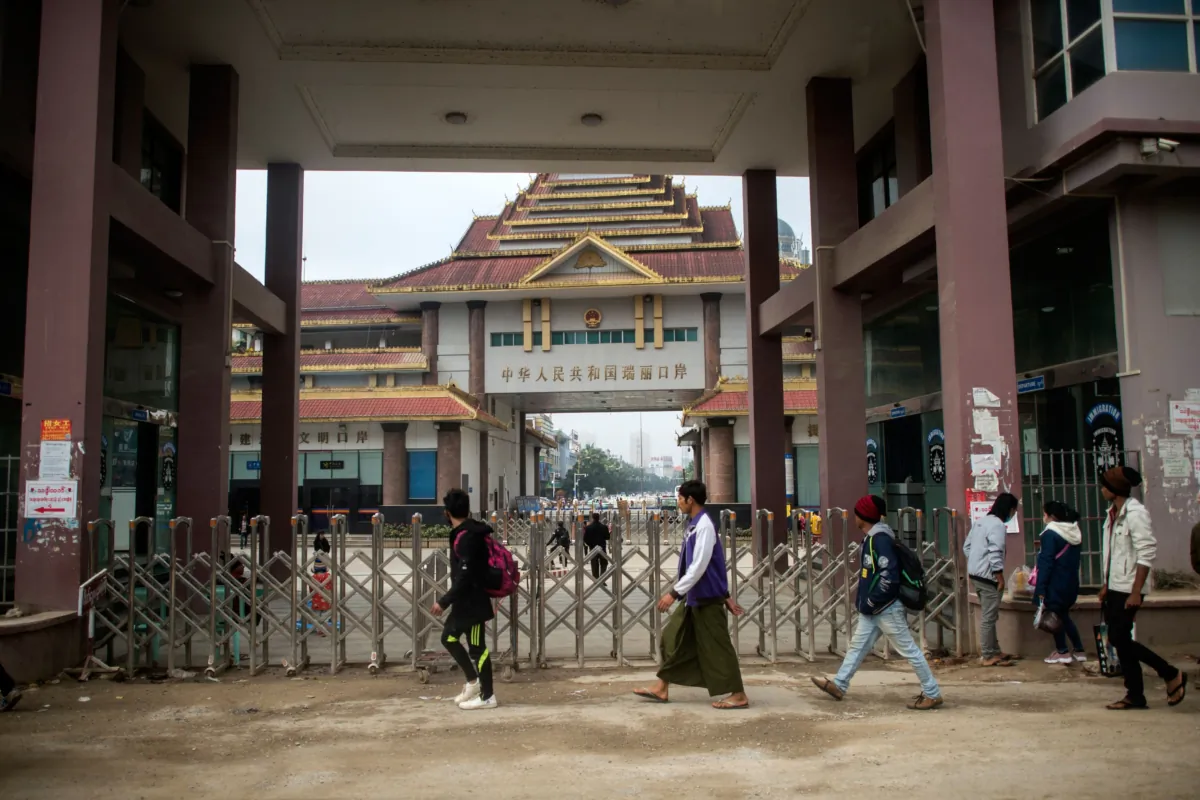 People arrive at the Muse town border gate in Burma's Shan State to cross into China, on Jan. 12, 2019. (Ye Aung Thu/AFP via Getty Images)