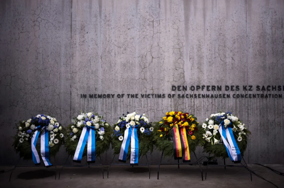 Wreaths at the memorial wall of the Nazi concentration camp Sachsenhausen after a ceremony marking the Holocaust Martyrs' and Heroes' Remembrance Day in Oranienburg, Germany, on April 18, 2023. (Markus Schreiber/AP Photo)