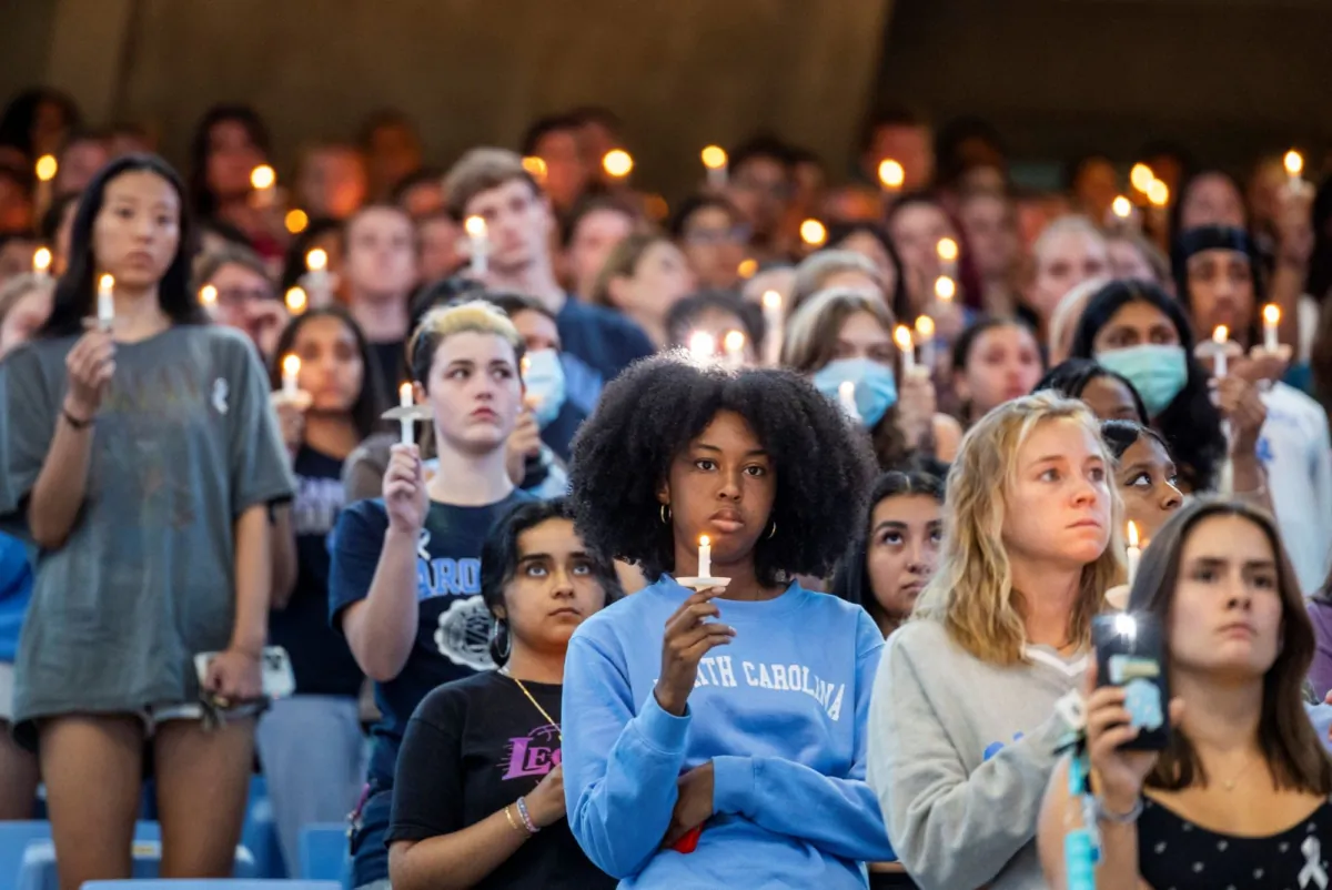 University of North Carolina-Chapel Hill students, faculty and family hold a candlelight vigil in Chapel Hill, N.C., in honor of professor Zijie Yan, on Aug 30, 2023. (Travis Long/The News & Observer via AP)