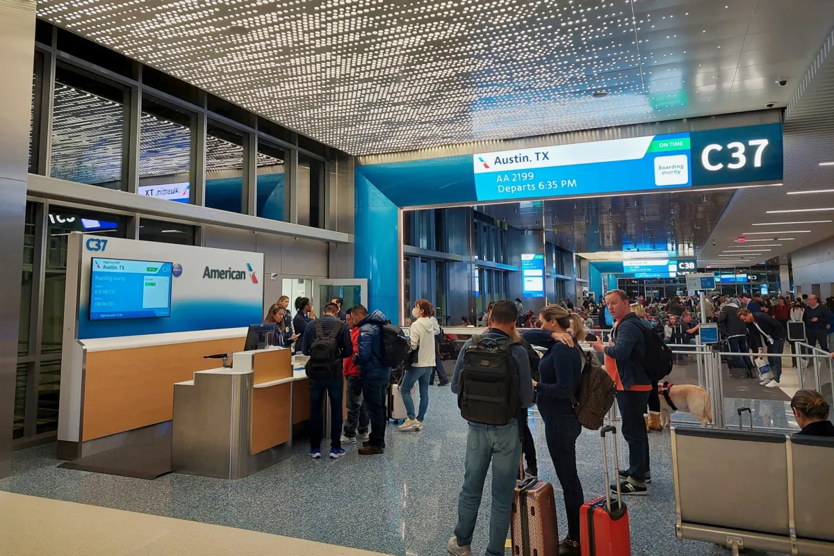 Travelers prepare to board an American Airlines flight to Austin, Texas at Gate C37 at Dallas Fort Worth International Airport (DFW). (JW_PNW/Shutterstock)
