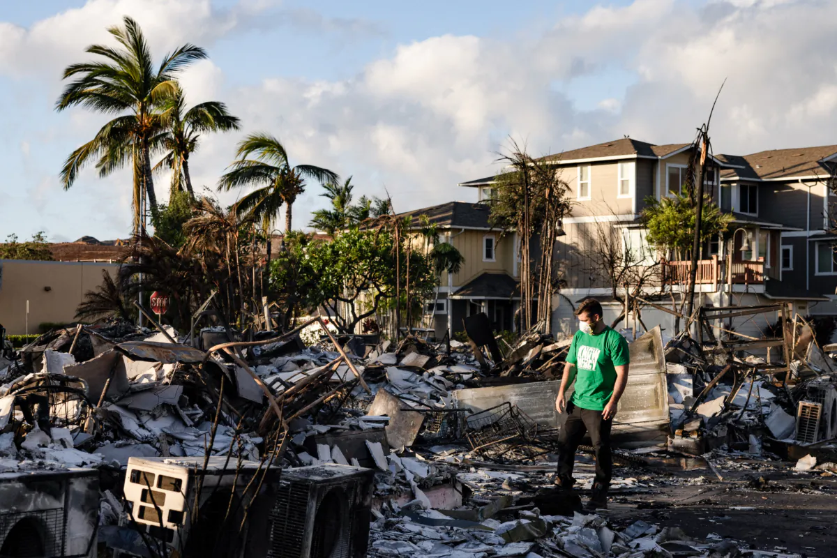 A Mercy Worldwide volunteer makes a damage assessment of charred apartment complex in the aftermath of a wildfire in Lahaina, Hawaii, on Aug. 12, 2023. (Yuki Iwamura/AFP via Getty Images)