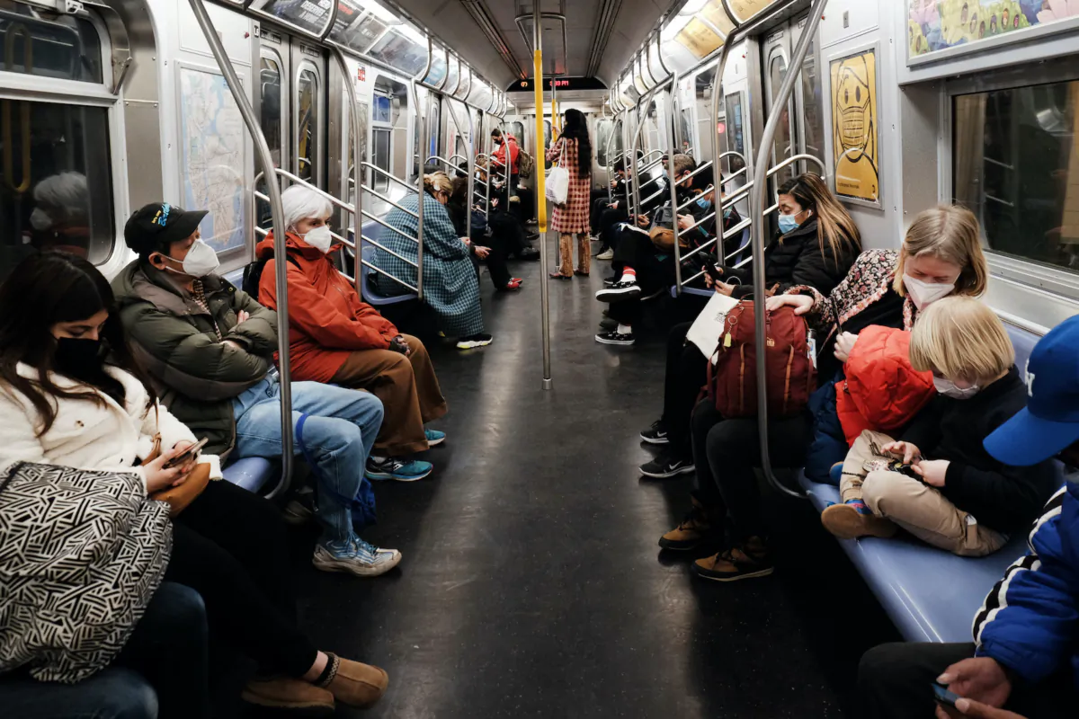People ride on an MTA subway F train on March 11, 2022 in New York City. (Spencer Platt/Getty Images)