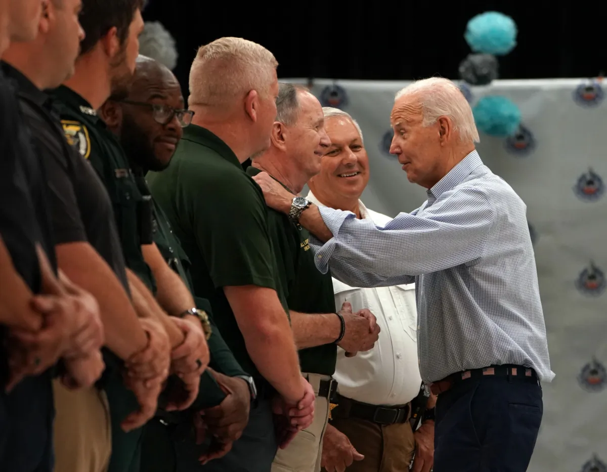 President Joe Biden greets first responders during a briefing about response and recovery efforts to the aftermath of Hurricane Idalia, at Suwannee Pineview Elementary School, in Live Oak, Fla., on Sept. 2, 2023. (Stefani Reynolds/AFP via Getty Images)