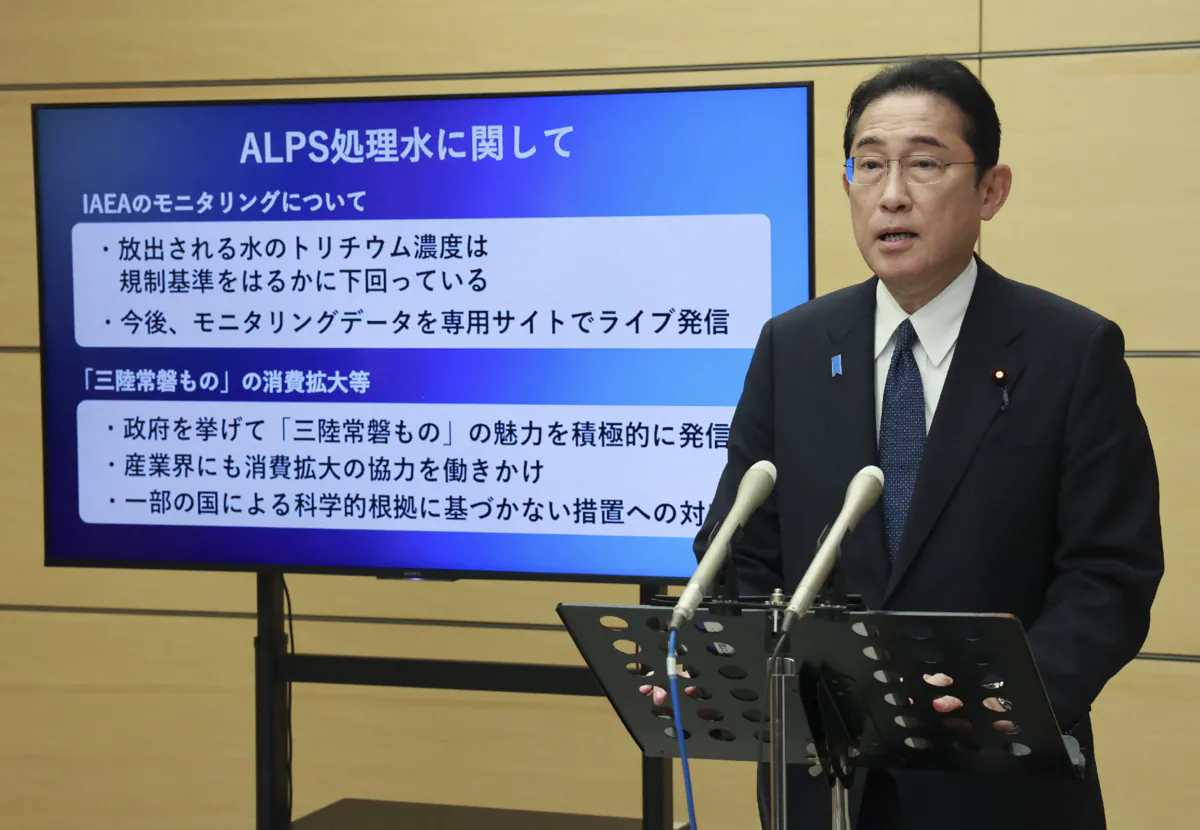 Japanese Prime Minister Fumio Kishida speaks to reporters about ALPS-treated water from the Fukushima Daiichi Nuclear Power Plant at the prime minister's office on Aug. 24, 2023. (STR/JIJI Press/AFP via Getty Images)