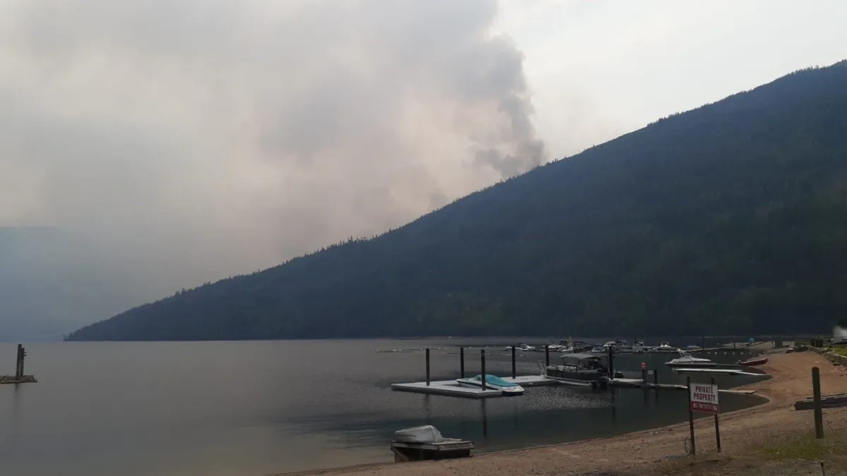 Evacuation orders for 26 properties in British Columbia's Kamloops and Shuswap Lake areas affected by two separate wildfires have been lifted and placed on alert status. Smoke rises from the Bush Creek East wildfire in an undated handout photo. (The Canadian Press/HO-B.C. Wildfire Service)
