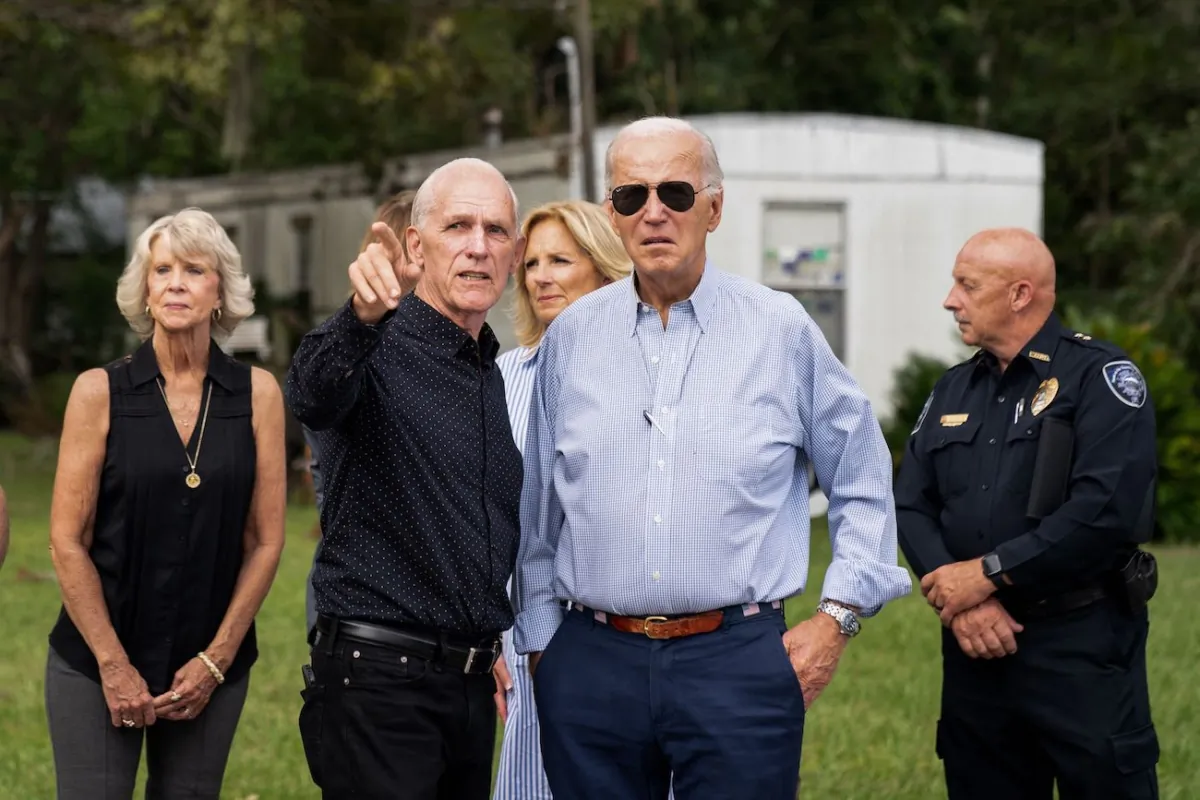 President Joe Biden listens as Live Oak Mayor Frank Davis gives him and First Lady Jill Biden a tour of the areas impacted by Hurricane Idalia in Live Oak, Fla. on Sept. 2, 2023.(Stefani Reynolds/AFP via Getty Images)