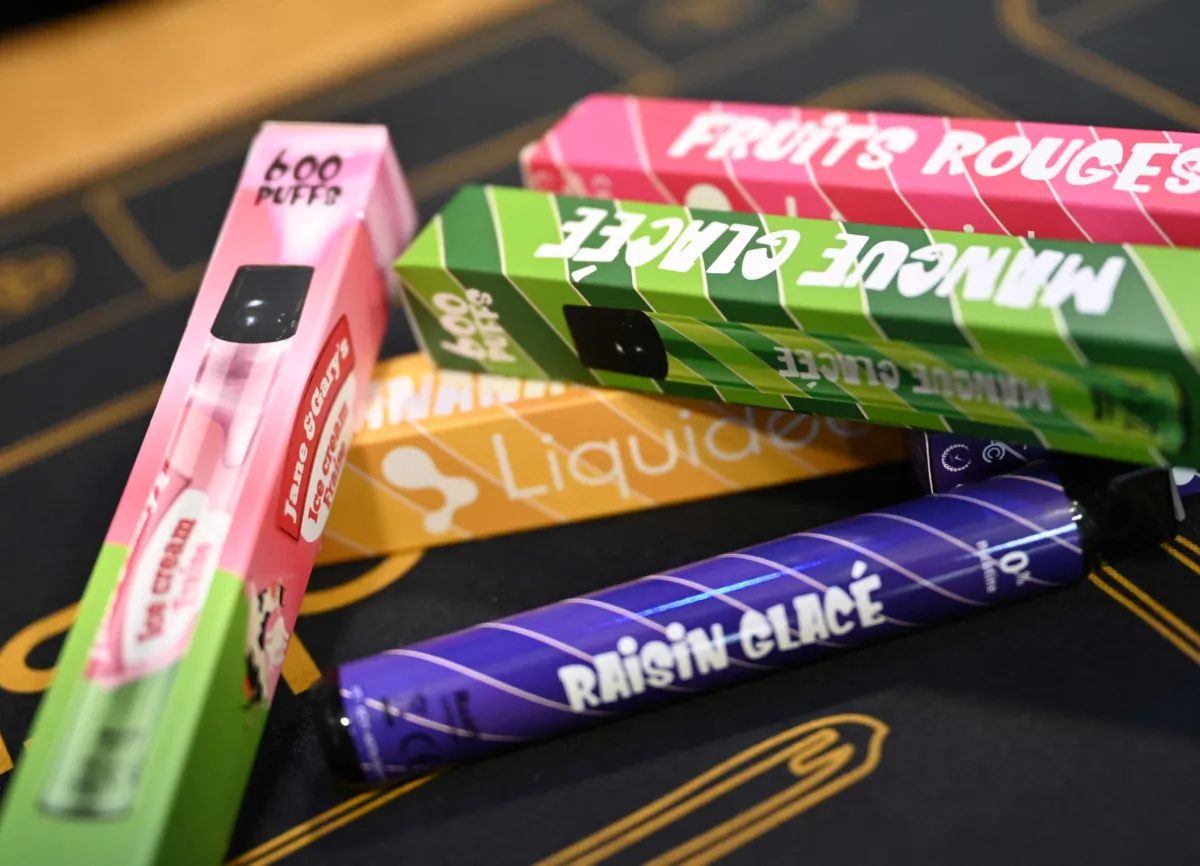 Boxes of 'puffs' disposable electronic cigarettes displayed on table at La Vapotitheque store in Bethune, northern France, on May 25, 2022. (Denis CharleT/AFP via Getty Images)