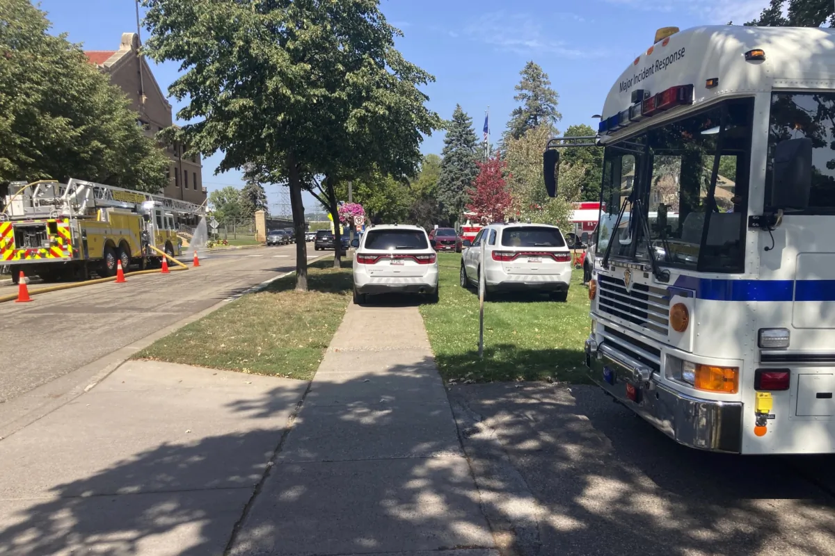 A fleet of emergency vehicles sit parked outside of Minnesota Correctional Facility-Stillwater prison in Bayport, Minn., on Sept. 3, 2023. (David Boehnke via AP)