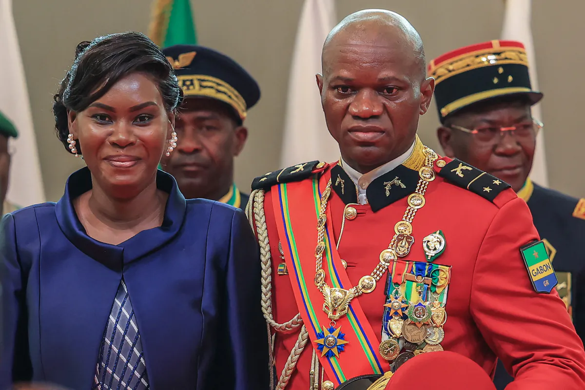 Gabon's new strongman, Gen. Brice Oligui Nguema, (2nd R) poses for a photograph with his wife, Zita Nyangue Oligui Nguema, as he is inaugurated as Gabon's interim president, in Libreville on Sept. 4, 2023. (AFP via Getty Images)