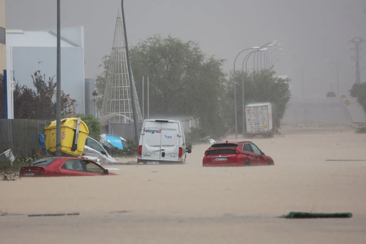 Cars are stranded on a flooded road, following heavy rain in Toledo, Spain, on Sept. 4, 2023. (Isabel Infantes/Reuters)