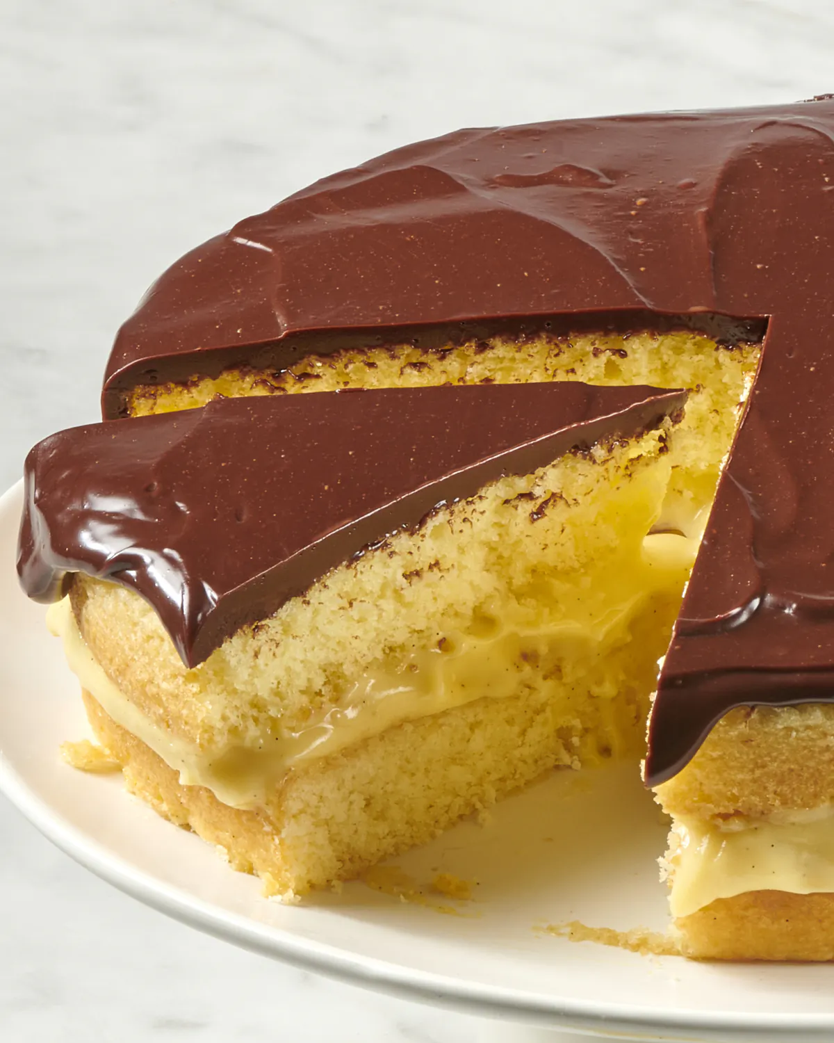 With three delicious layers of sponge cake, pastry cream, and chocolate ganache, this nostalgic dessert is a stunner. (Alex Lepe/TNS)