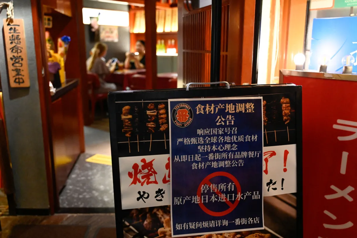 A sign reading "Suspend the sale of all fish products imported from Japan"is displayed in an area of Japanese restaurants in Beijing on Aug. 27, 2023. (Pedro Pardo/AFP via Getty Images)