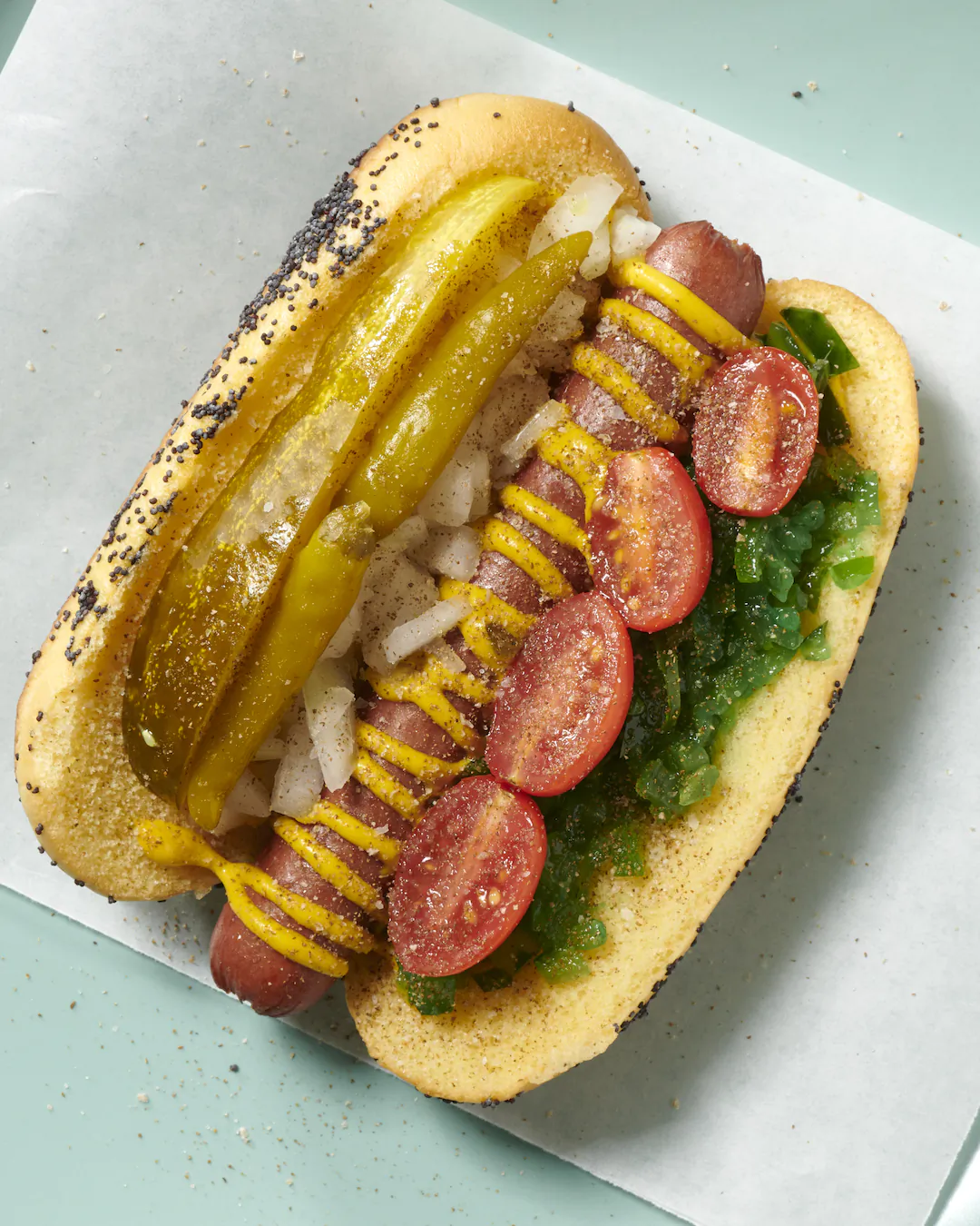 Recreate the Windy City's iconic delicacy with all-beef juicy hot dogs, fluffy poppy seed buns, and loads of crunchy, salty toppings. (Tribune News Service)