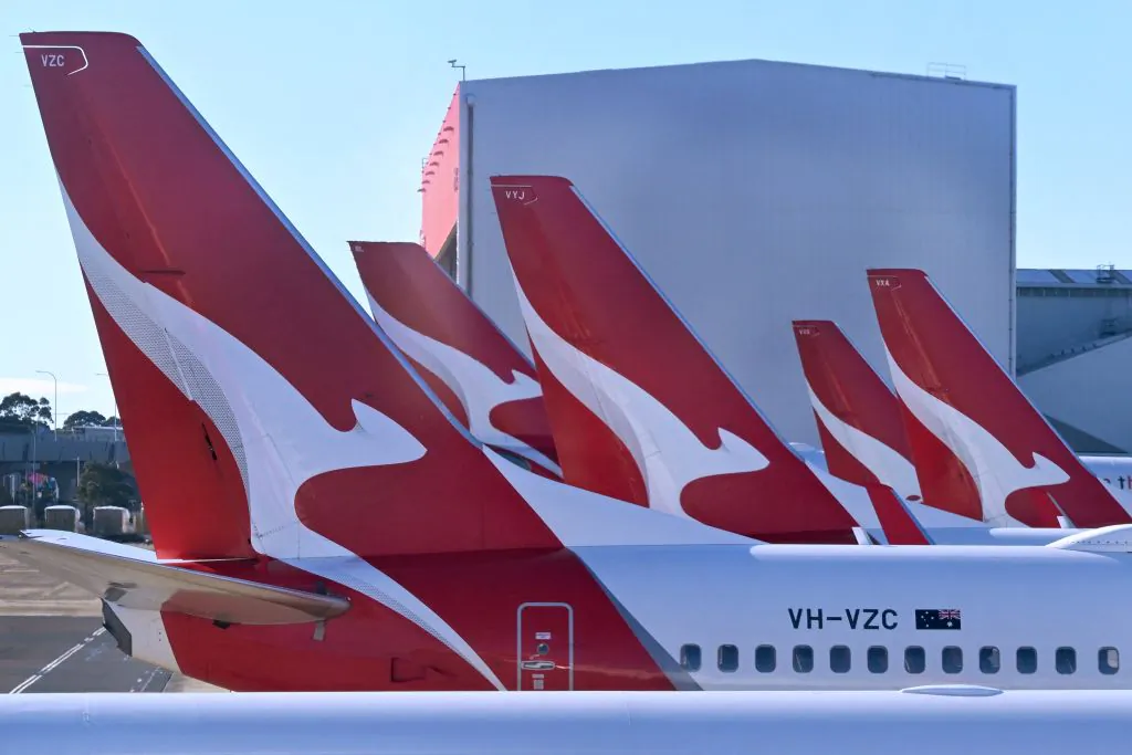 A photo taken on Aug. 20, 2023, shows a line-up of Qantas planes at Sydney's Kingsford Smith Airport. (William West/AFP via Getty Images)