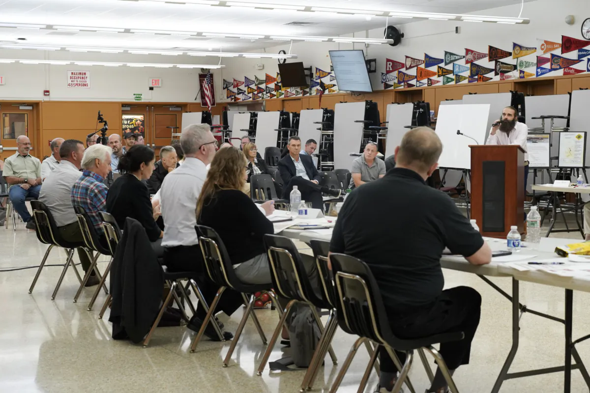 Restaurant owner Sean Donnelly presents at the Downtown Revitalization Initiative local planning committee meeting at Port Jervis High School in Orange County, N.Y., on Aug. 31, 2023. (Cara Ding/The Epoch Times)