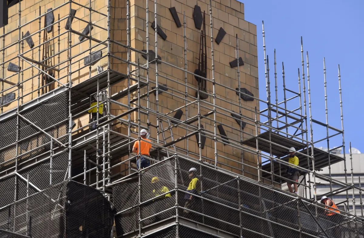 This photo shows construction workers on a building site in Sydney, Australia, on March 6, 2018. (William West/AFP via Getty Images)