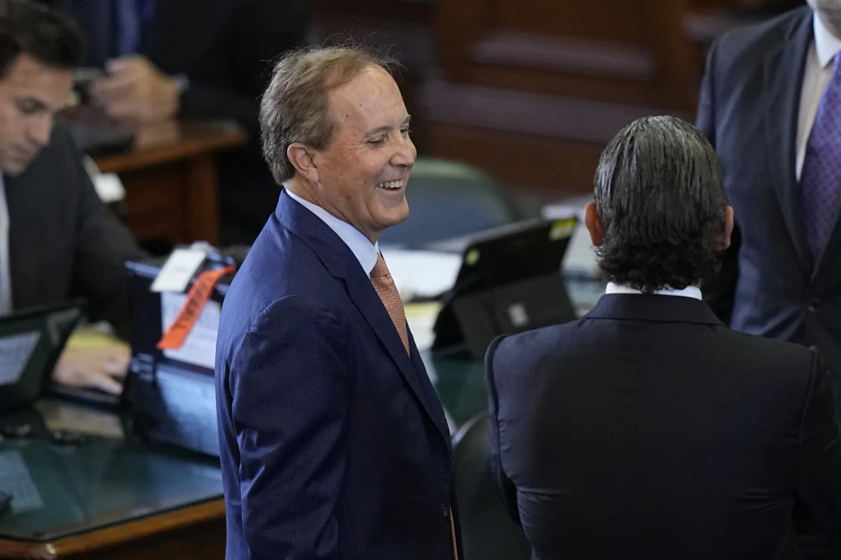 Texas state Attorney General Ken Paxton (L) talks with his attorneys before his impeachment trial for Texas Attorney General Ken Paxton in the Senate Chamber at the Texas Capitol in Austin, Texas, on Sept. 5, 2023. (Eric Gay/AP Photo)