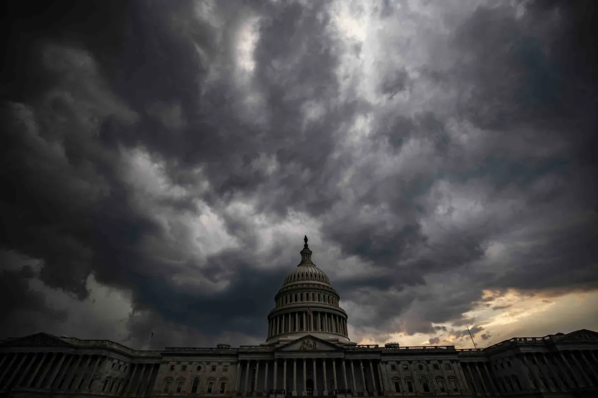 Storm clouds hang above the U.S. Capitol in Washington, in a file photo. (Samuel Corum/Getty Images)