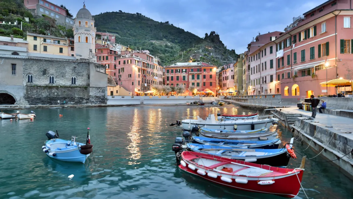 Enjoy a sunset stroll along Vernazza's breakwater at dusk when colors deepen and glow. (Cameron Hewitt/ Rick Steves' Europe)