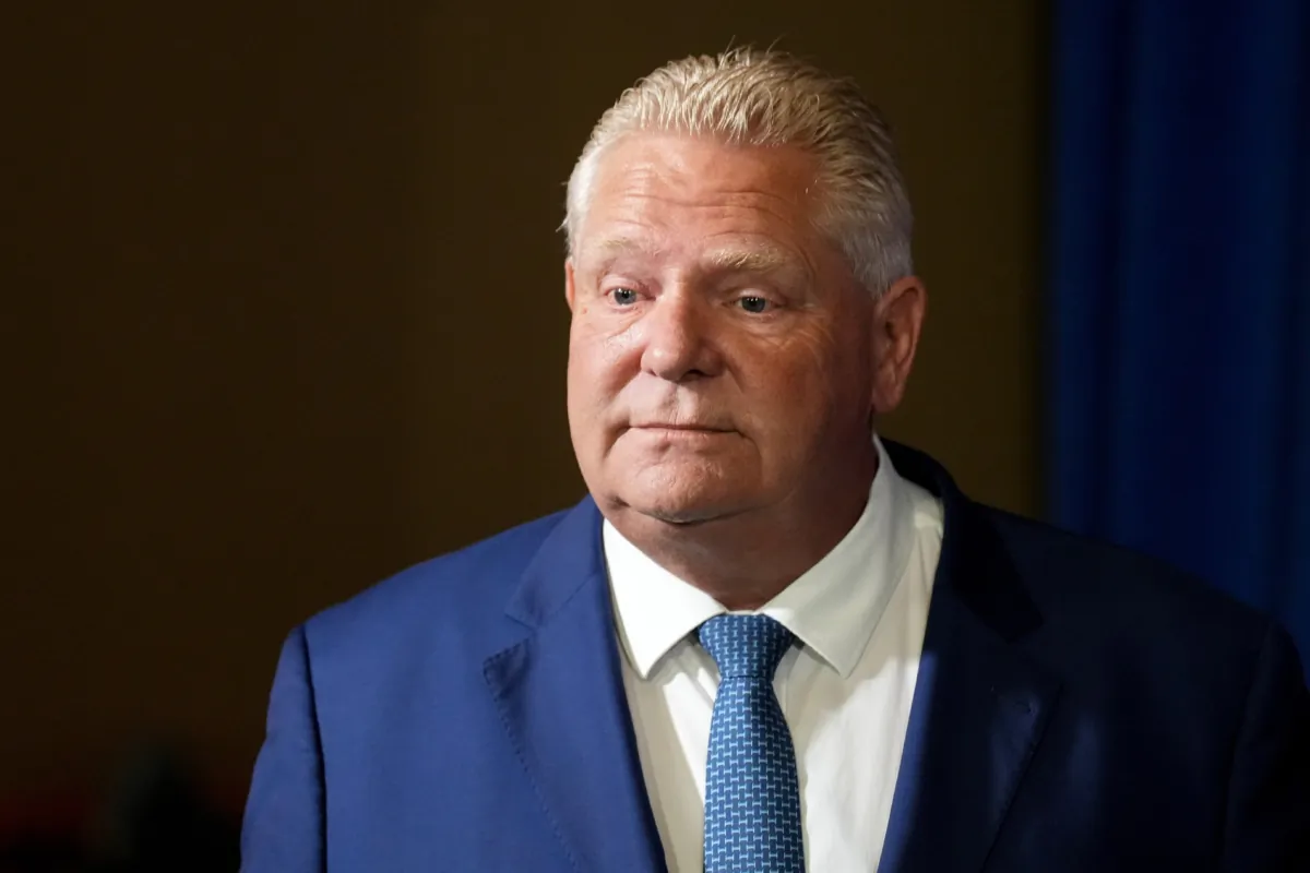 Ontario Premier Doug Ford enters a room to speak to journalists at the Queen’s Park legislature in Toronto on Sept. 5, 2023. (The Canadian Press/Chris Young)