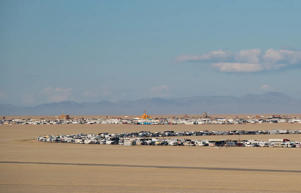 A line of vehicles waits in a 7.5-hour line to exit the Burning Man festival in Black Rock, Nev., on Sep. 4, 2023. (John Fredricks/The Epoch Times)