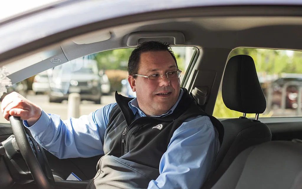 A man starts his first UberX ride in Canberra, Australia, on Oct. 30, 2015. (Martin Ollman/Getty Images)