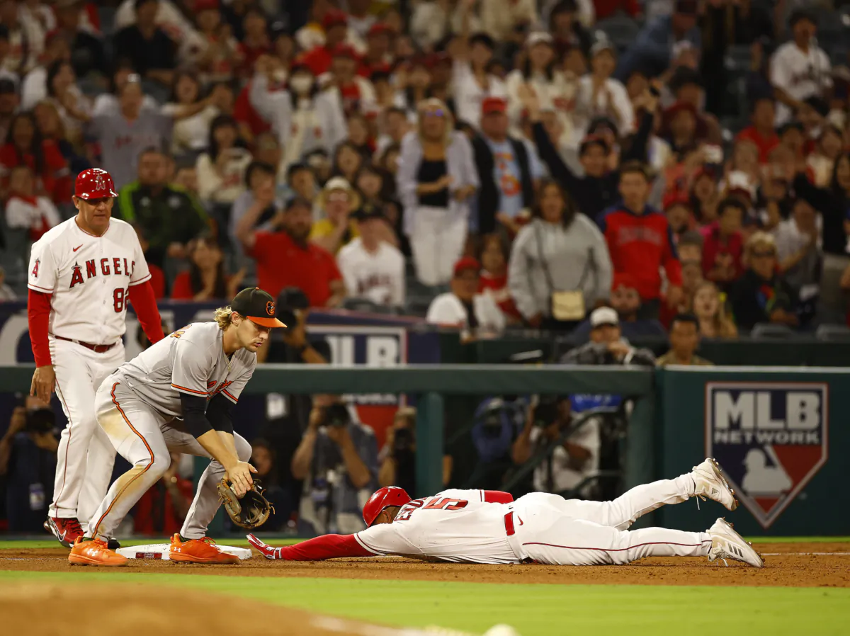 Eduardo Escobar (5) of the Los Angeles Angels triples against the Baltimore Orioles in the eighth inning at Angel Stadium of Anaheim in Anaheim, Calif., on Sept. 5, 2023. (Ronald Martinez/Getty Images)
