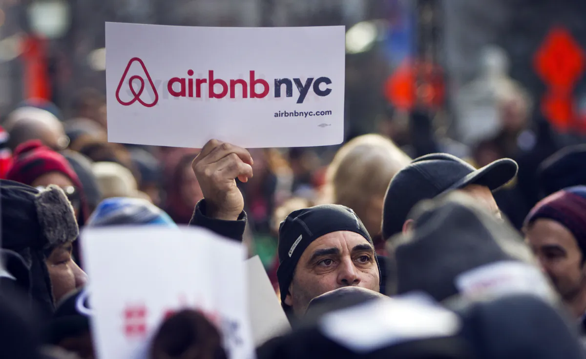Supporters of Airbnb hold a rally outside City Hall in New York on Jan. 20, 2015. (Bebeto Matthews/AP Photo)