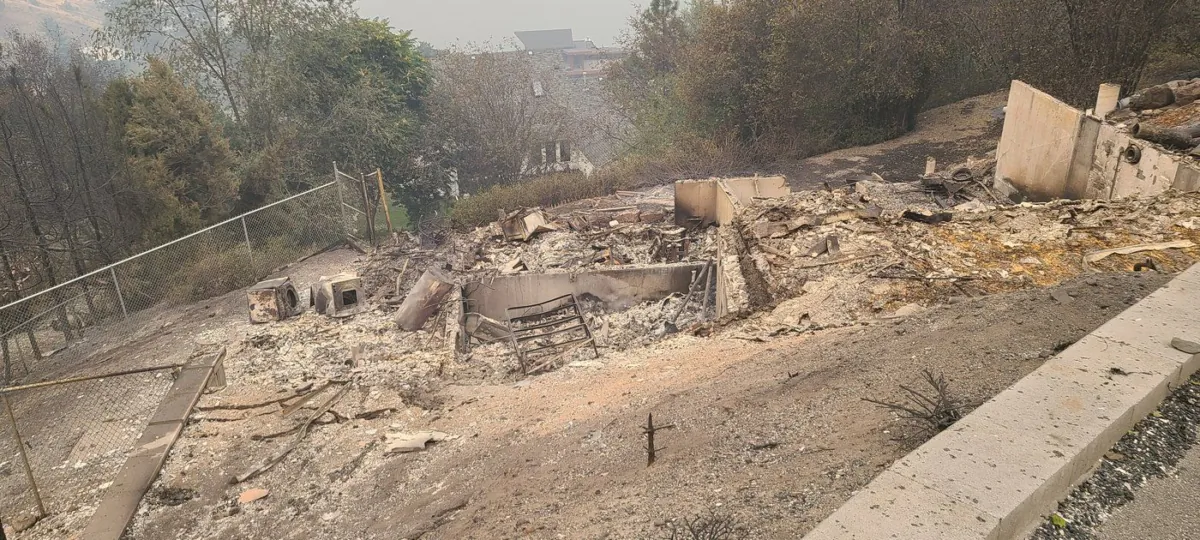 West Kelowna resident Annick deGooyer and her husband Rob Baker went on a bus tour on Sept. 1 to take a first-hand look at their burned-down home in Traders Cove, seen in an undated handout photo, a place in which they have lived for over twenty years. (The Canadian Press/HO-Annick deGooyer)
