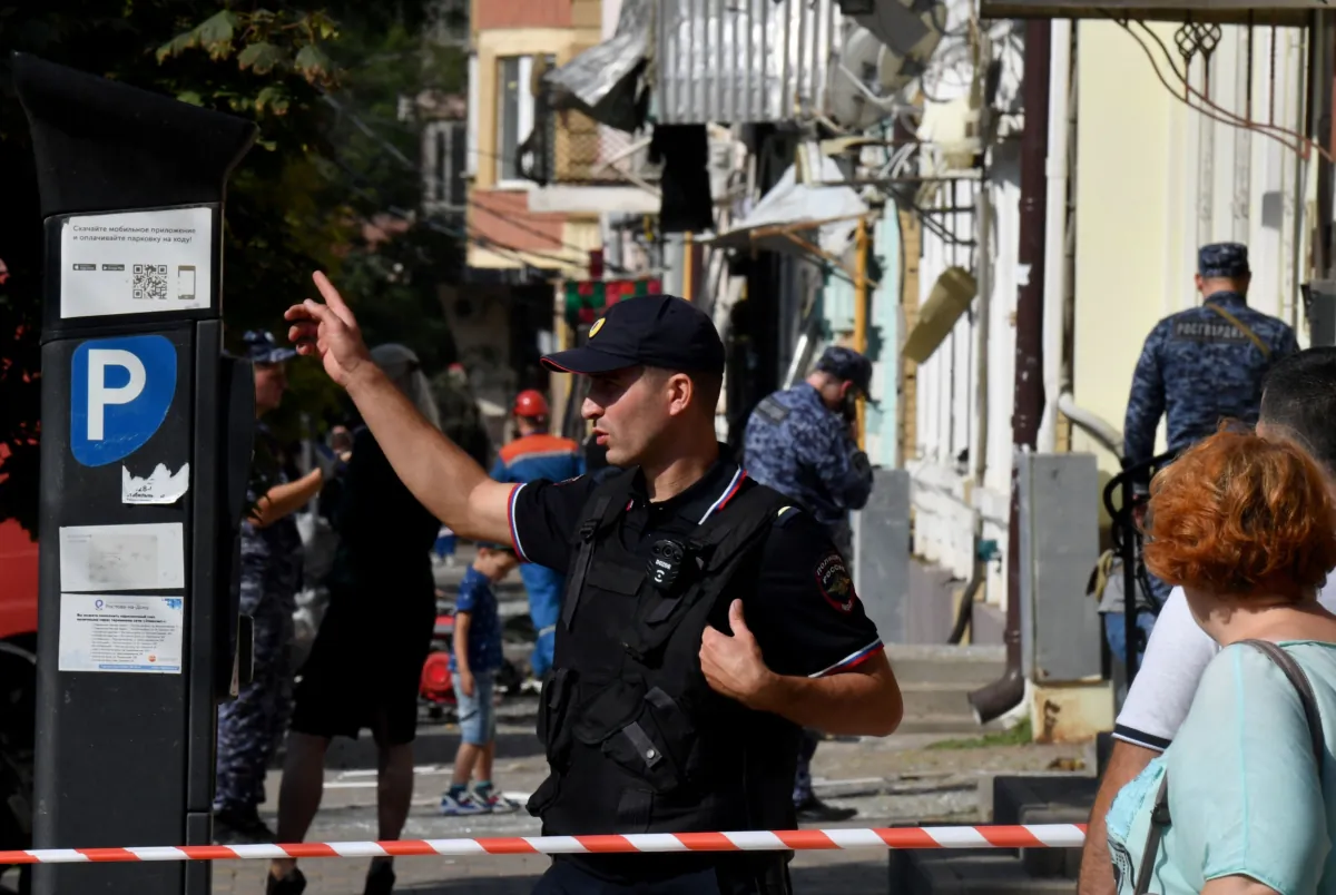 A police officer gestures at the site where a Ukrainian drone was downed by air defense system, in central Rostov-on-Don, Russia, on Sept. 7, 2023. (Olga Maltseva/AFP via Getty Images)