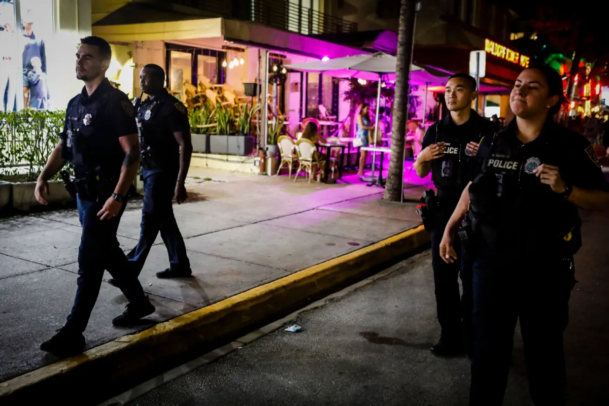Miami Beach Police patrol Ocean Drive before a curfew goes into effect during Spring Break in Miami Beach, Florida, on March 24, 2022. (EVA MARIE UZCATEGUI/AFP via Getty Images)