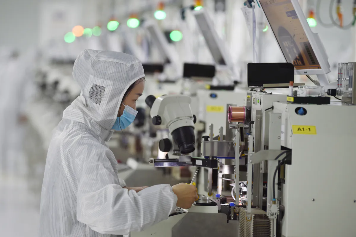 A worker produces semiconductor chips at a workshop in Suqian, in China's eastern Jiangsu Province, on Feb. 28, 2023. (STR/AFP via Getty Images)
