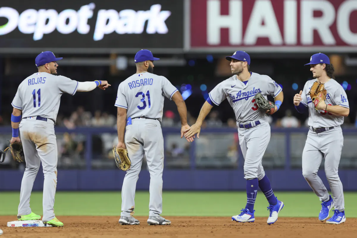Chris Taylor (3) of the Los Angeles Dodgers celebrates with teammates after winning the game against the Miami Marlins at loanDepot park in Miami on Sept. 7, 2023. (Sam Navarro/Getty Images) 